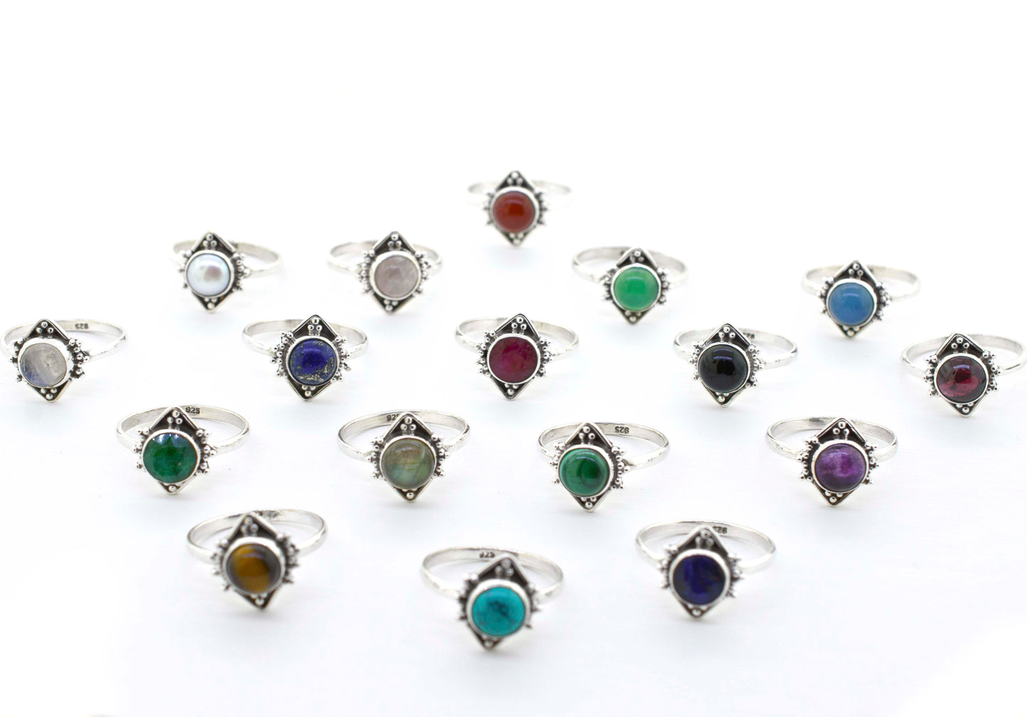 
                  
                    A group of Round Gemstone Rings With Oxidized Diamond Shape Patterns that exude a hippie vibe.
                  
                