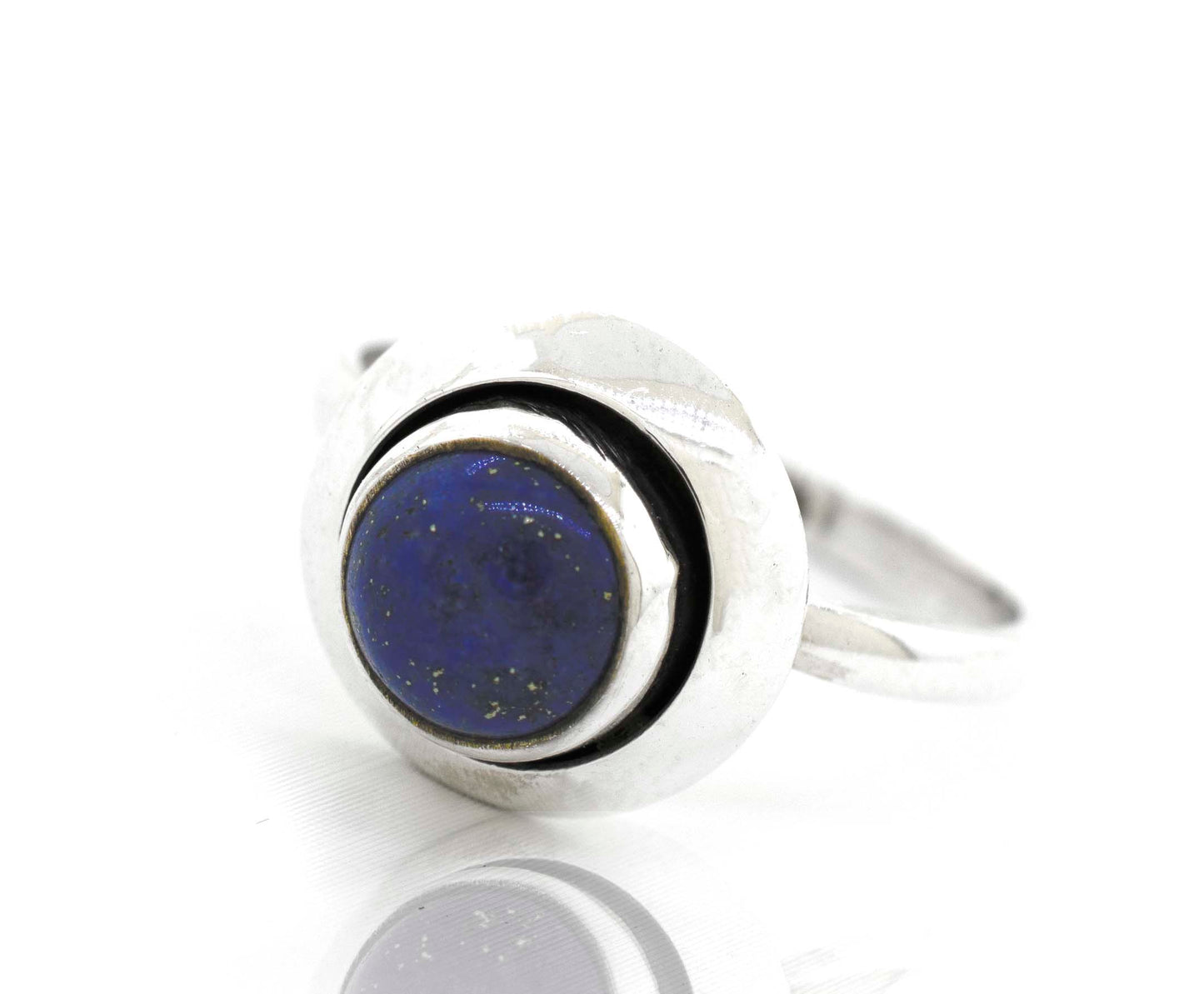 
                  
                    A round gemstone ring with oxidized outline and a lapis cabochon stone.
                  
                