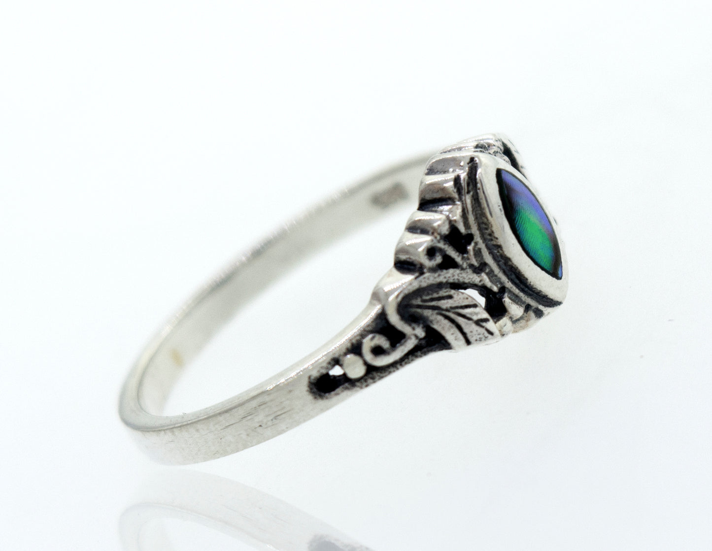
                  
                    A Dainty and Intricate Abalone Ring by Super Silver with an oval green stone.
                  
                