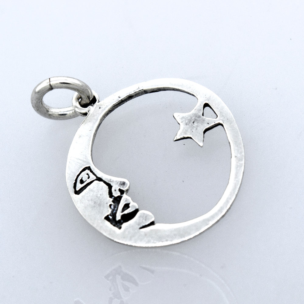 
                  
                    A celestial-style Crescent and Star Pendant with a moon and stars on it from Super Silver.
                  
                