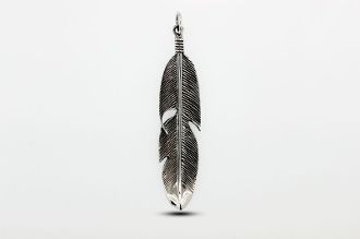 
                  
                    A rustic Super Silver Medium Size Feather Pendant hanging on a white background.
                  
                