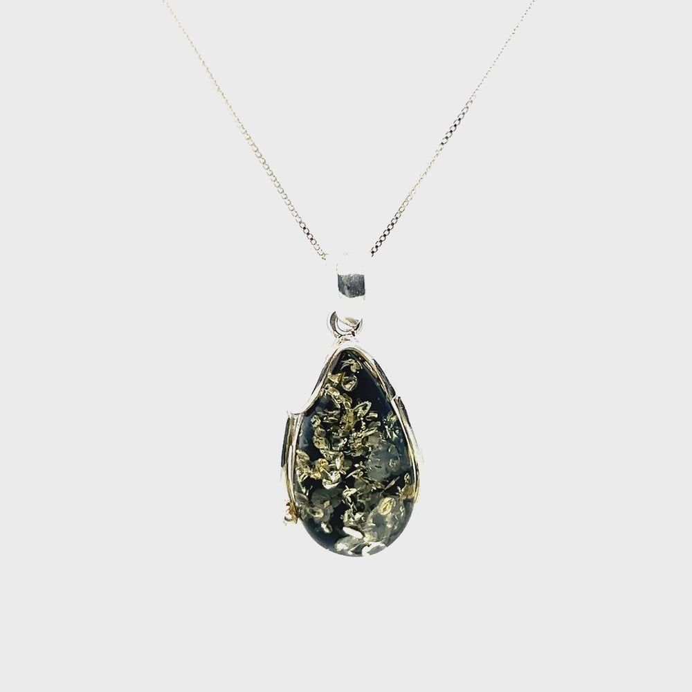 
                  
                    Load and play video in Gallery viewer, Large Green Amber Pendant
                  
                