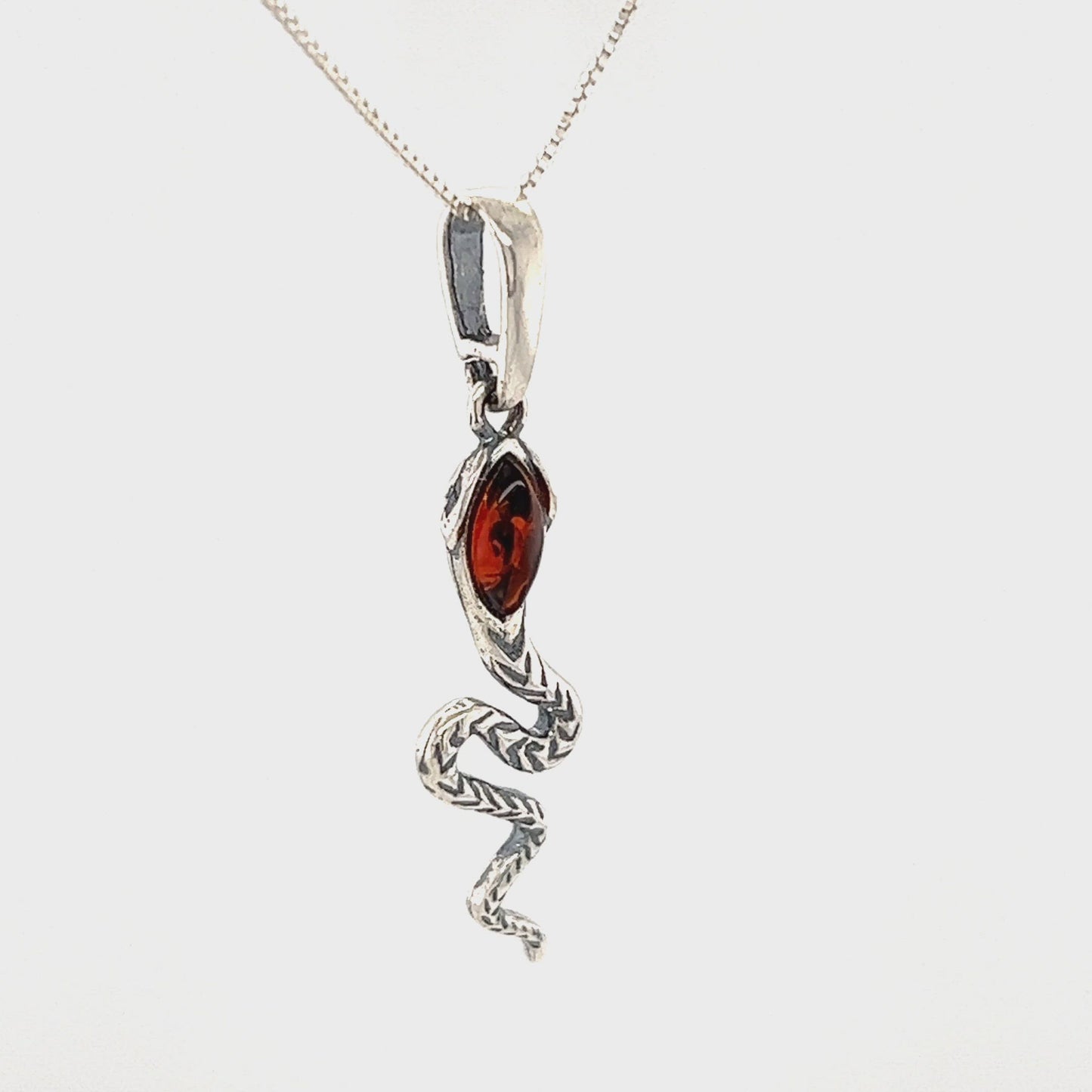 
                  
                    Load and play video in Gallery viewer, Alluring Amber Snake Pendant
                  
                