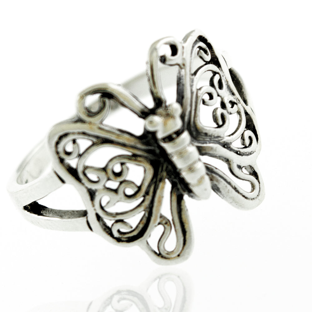 A boho silver Butterfly Ring With Filigree Design on a white background.