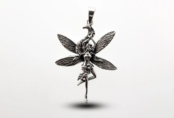 
                  
                    A Dancing Fairy Charm pendant, made of .925 Sterling Silver, measuring 2" long, on a white background by Super Silver.
                  
                