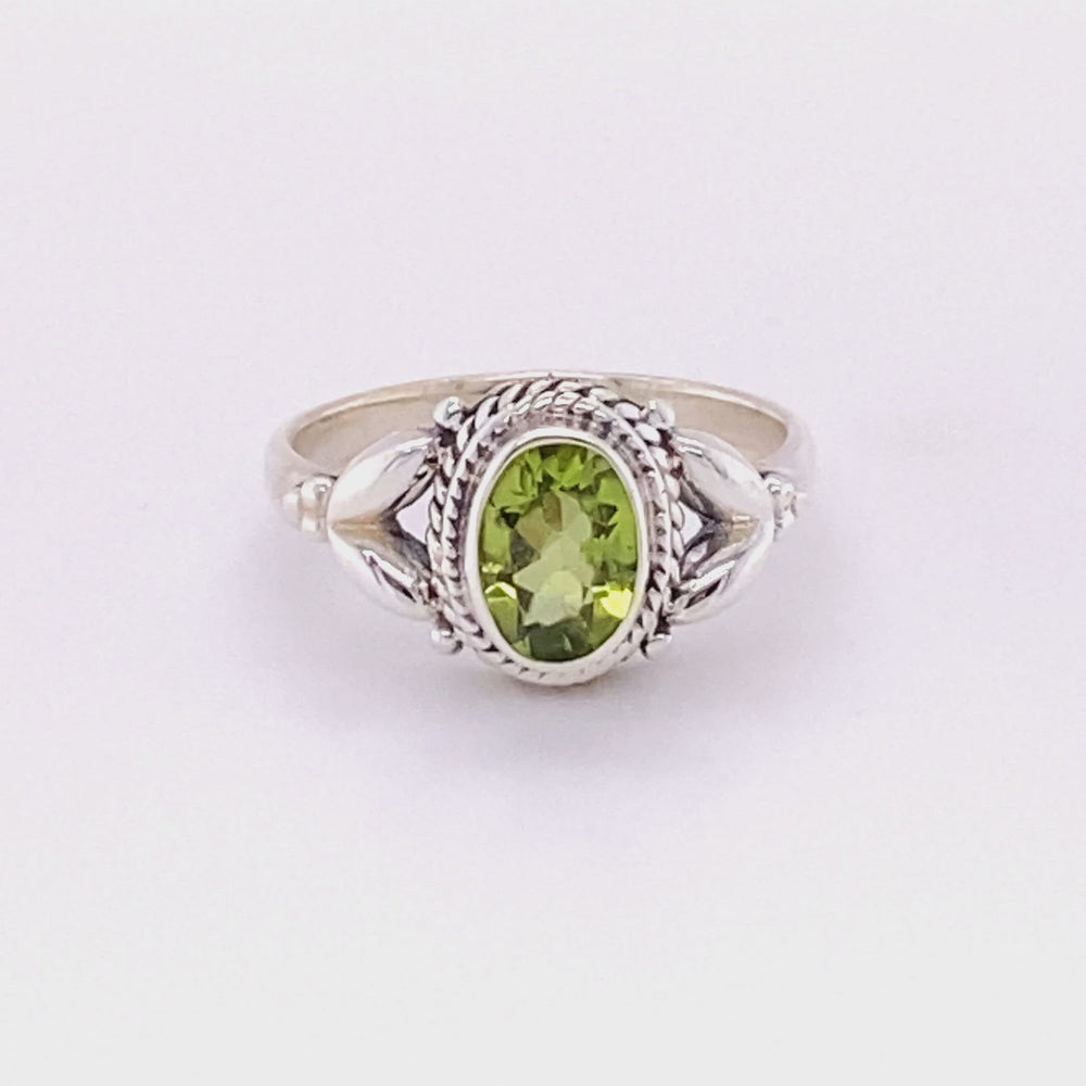 
                  
                    Load and play video in Gallery viewer, Oval Peridot Ring with Rope Border
                  
                