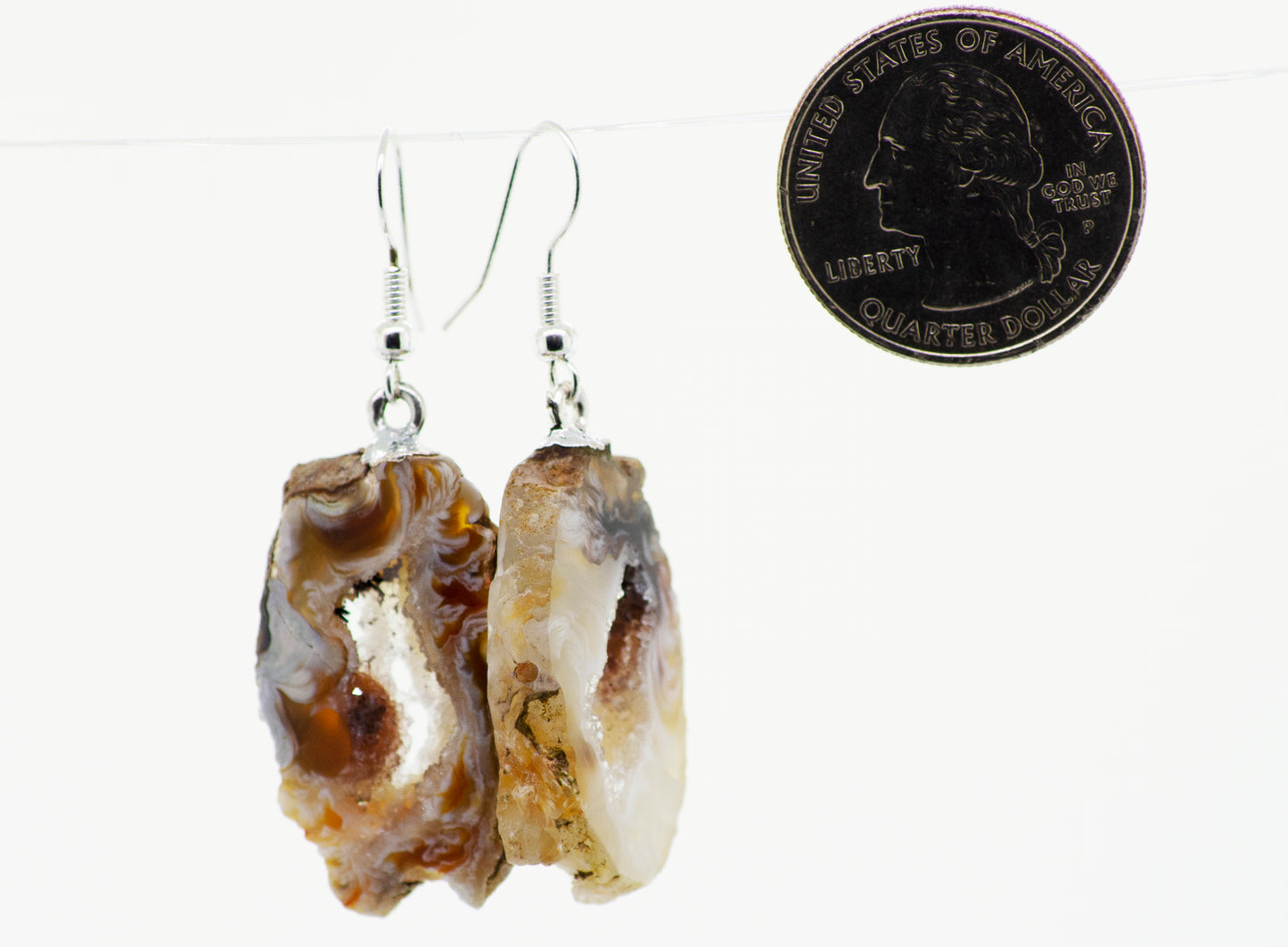 A stunning pair of Agate Geode Slice Earrings featuring a quarter-shaped center cutout, adorned with Agate Geode slices and dangling from elegant Silver-plated hooks.
