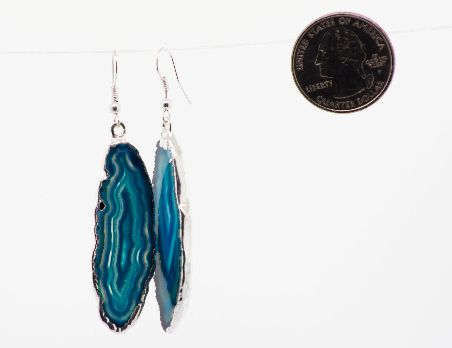 
                  
                    Various colors of Super Silver's Dyed Agate Slice earrings with a silver-plated border.
                  
                