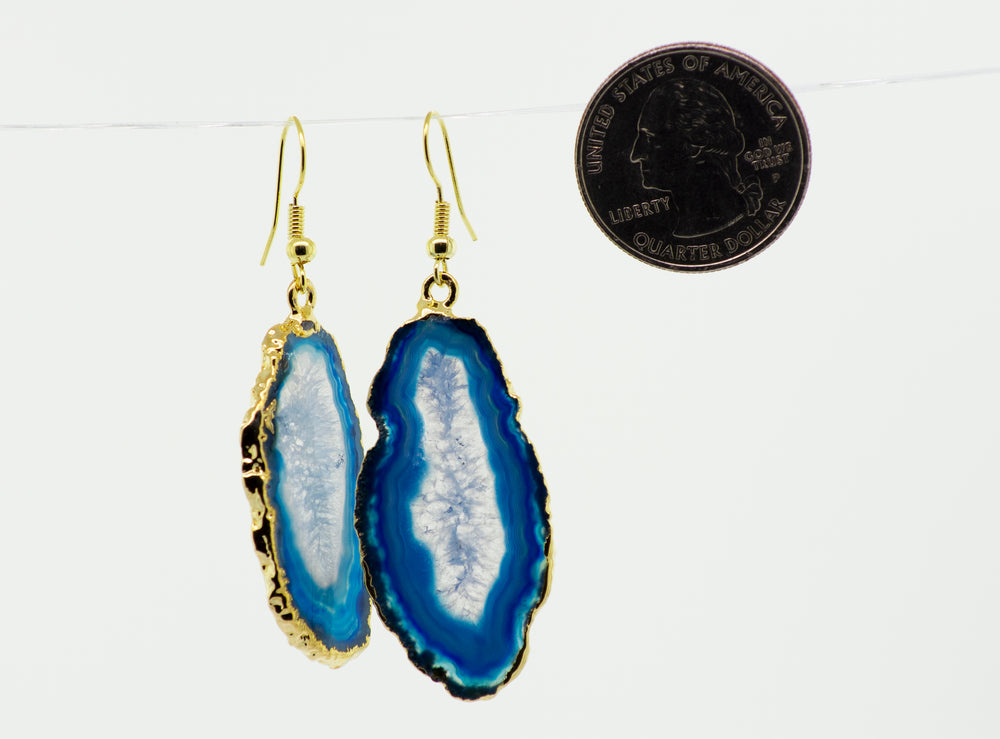 A pair of Super Silver Gold Agate Slice Earrings, featuring a stunning blue slice of stone.