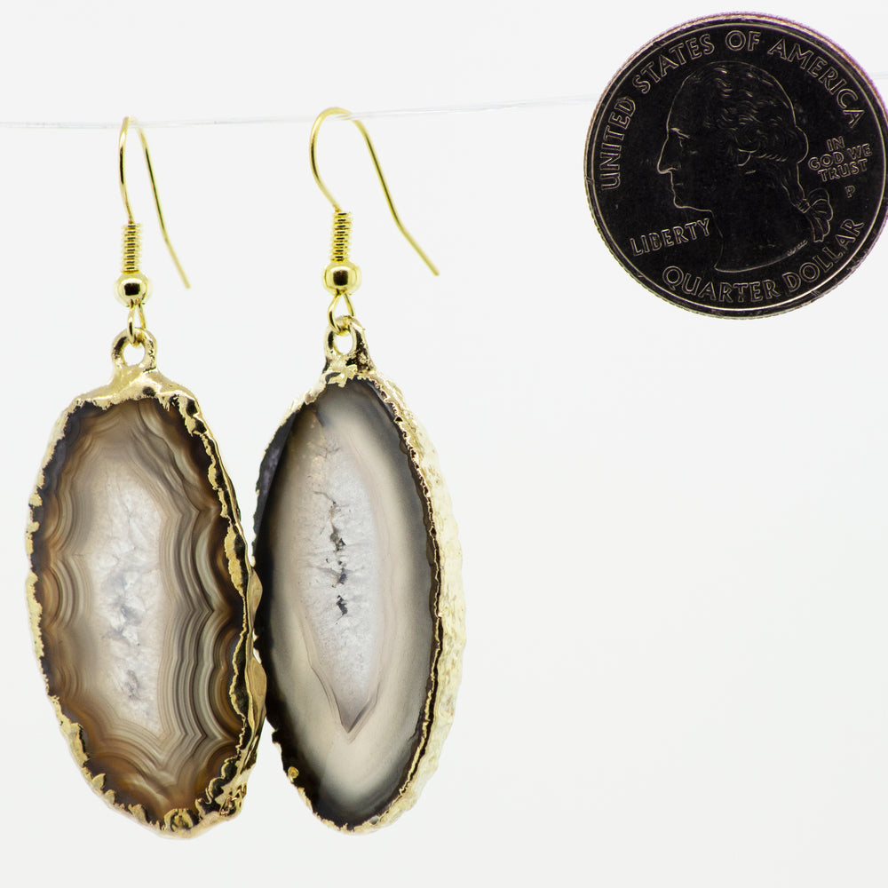 An elegant pair of Super Silver Gold Agate Slice Earrings featuring a unique coin accent.