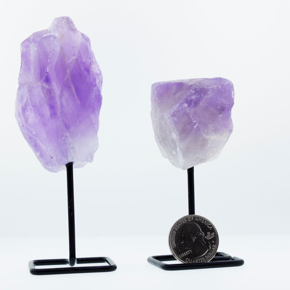 
                  
                    A decorative display featuring an irregular shaped stone with stand on a stylish stand.
                  
                
