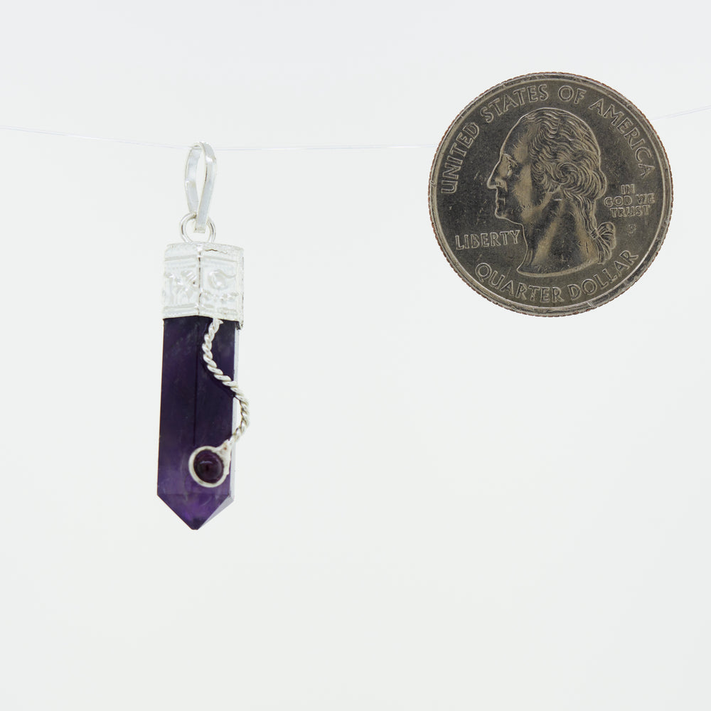 An Amethyst Pendant with Decorated Bail and Small Garnet Stone hanging from a Super Silver chain, perfect for everyday wear.