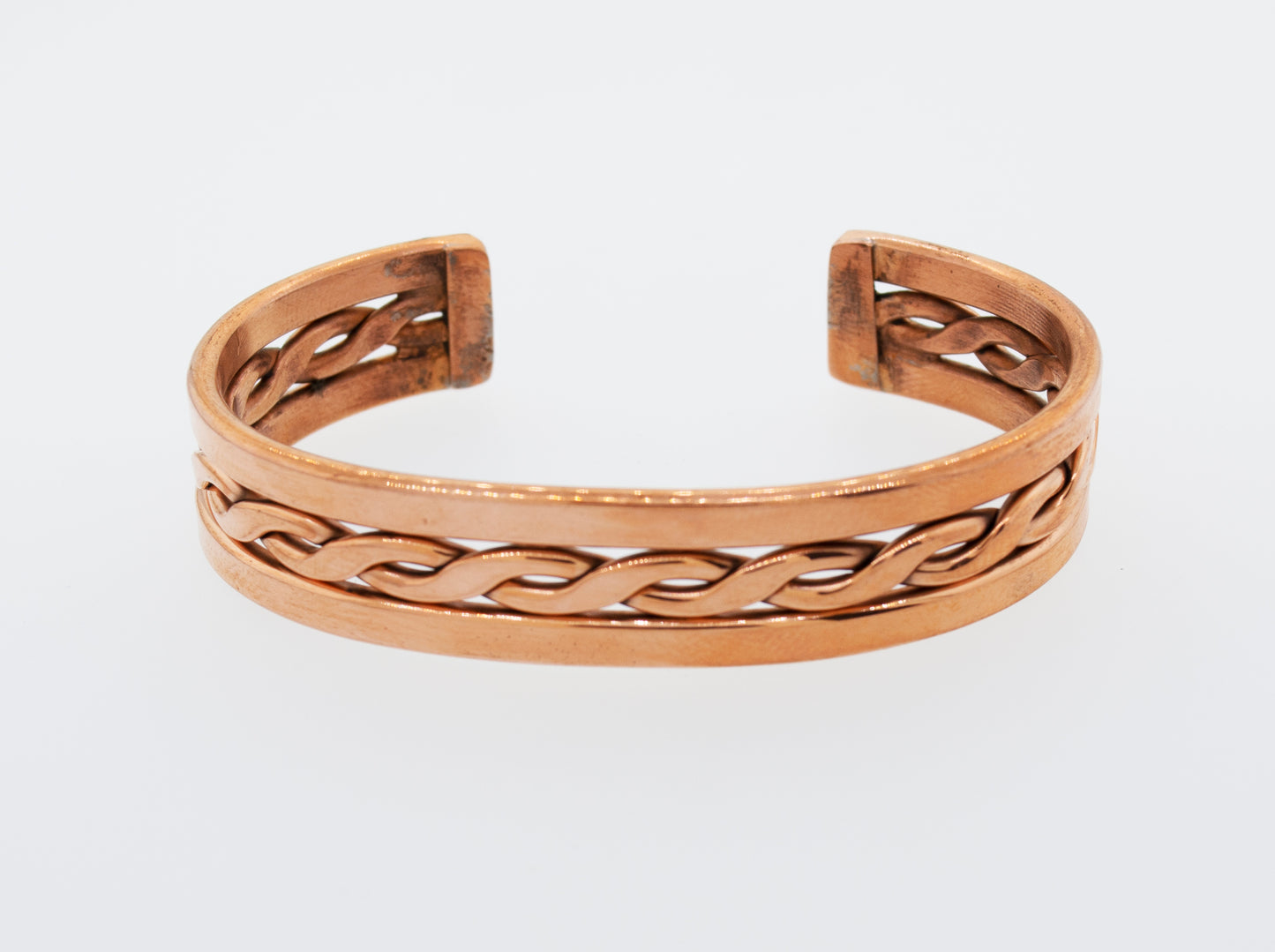 
                  
                    A Super Silver handmade copper cuff bracelet with a braided design, crafted in the style of Native American jewelry.
                  
                