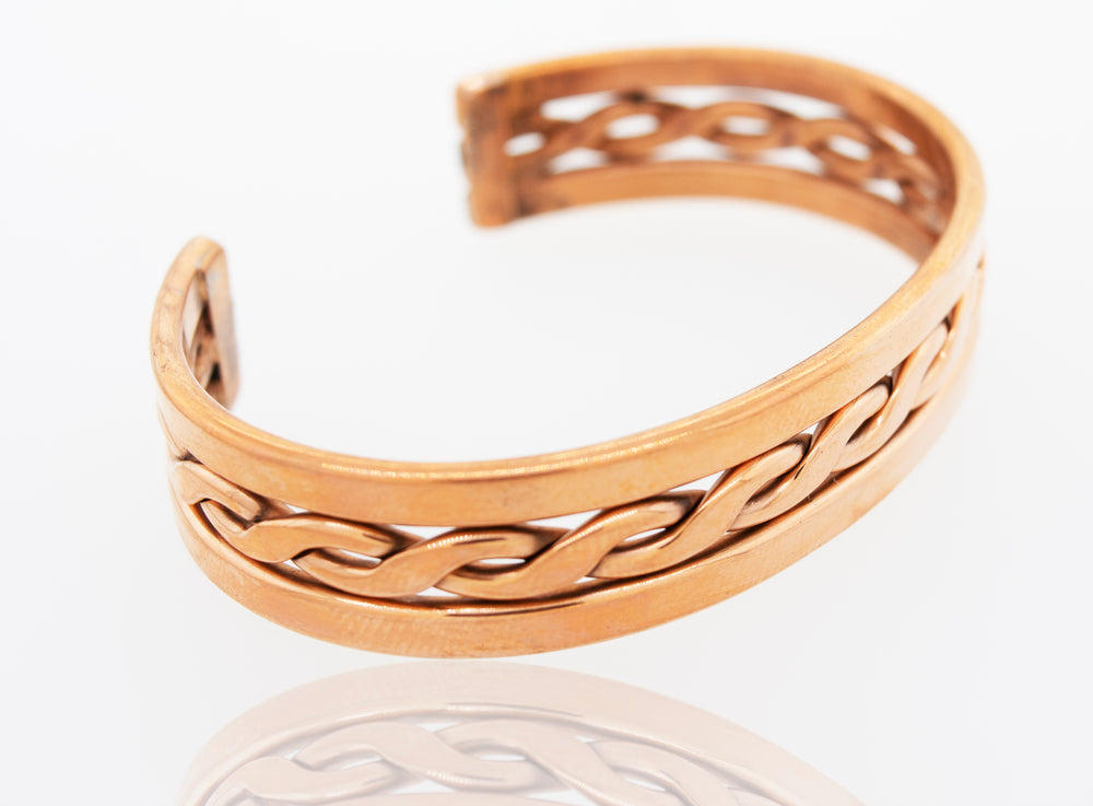 A Super Silver Native American Handmade Copper Bracelet with an intricate design.