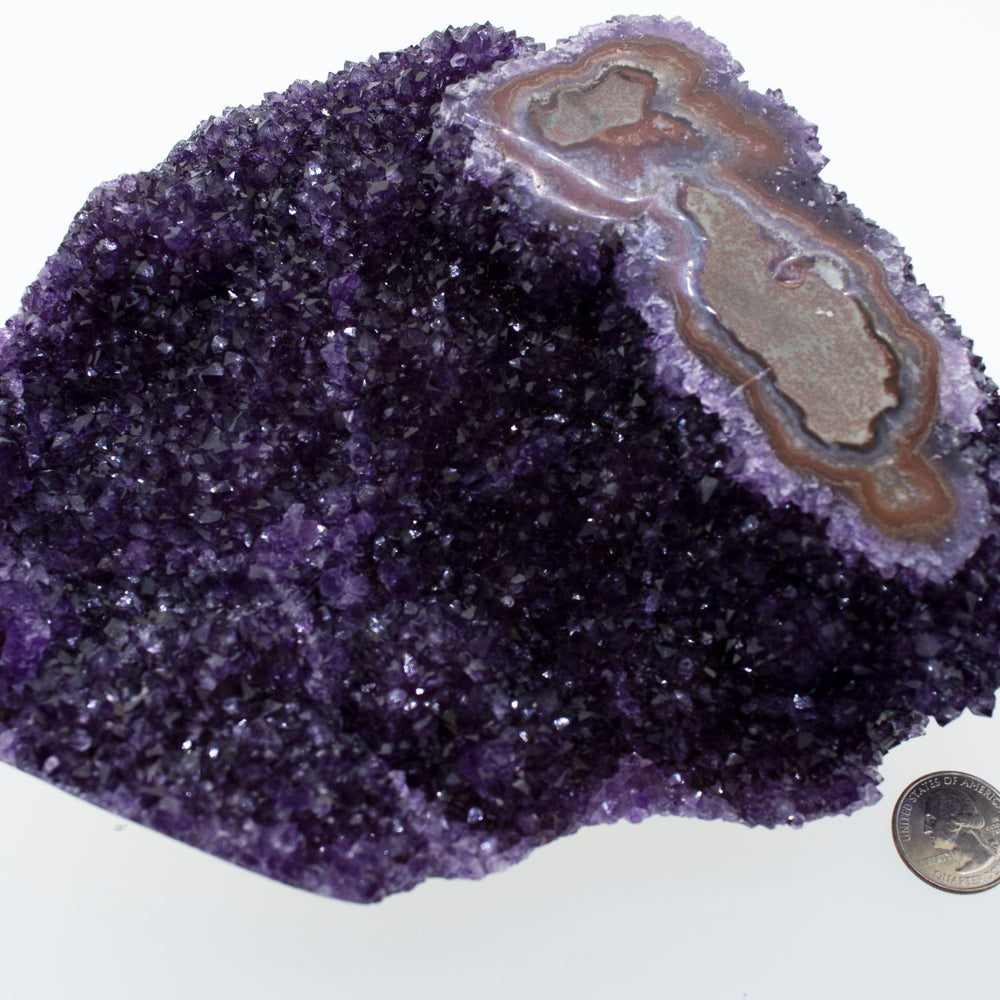 
                  
                    A Beautiful Freeform Amethyst Geode next to a dime.
                  
                