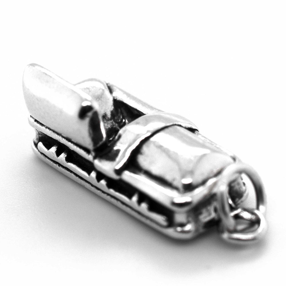 
                  
                    A Super Silver Open Coffin charm with a Halloween-themed seat on it.
                  
                