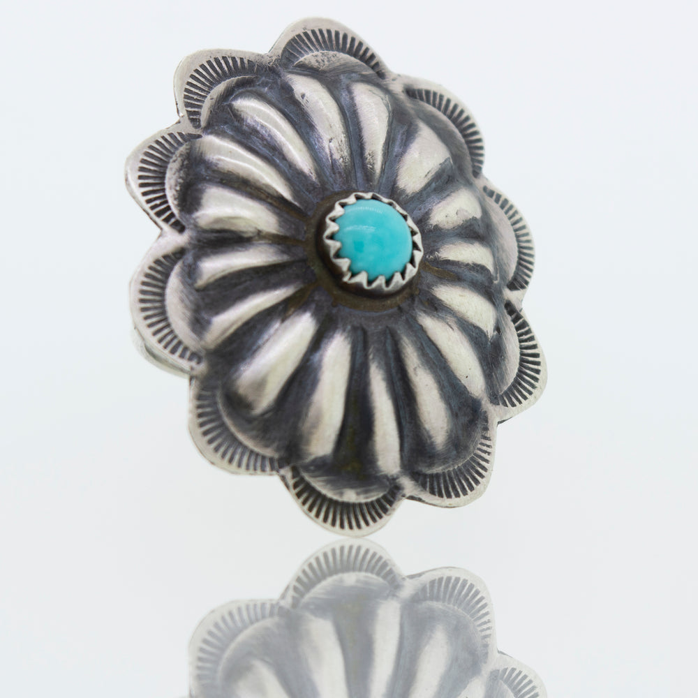 A cultural silver Native American Turquoise Flower ring.