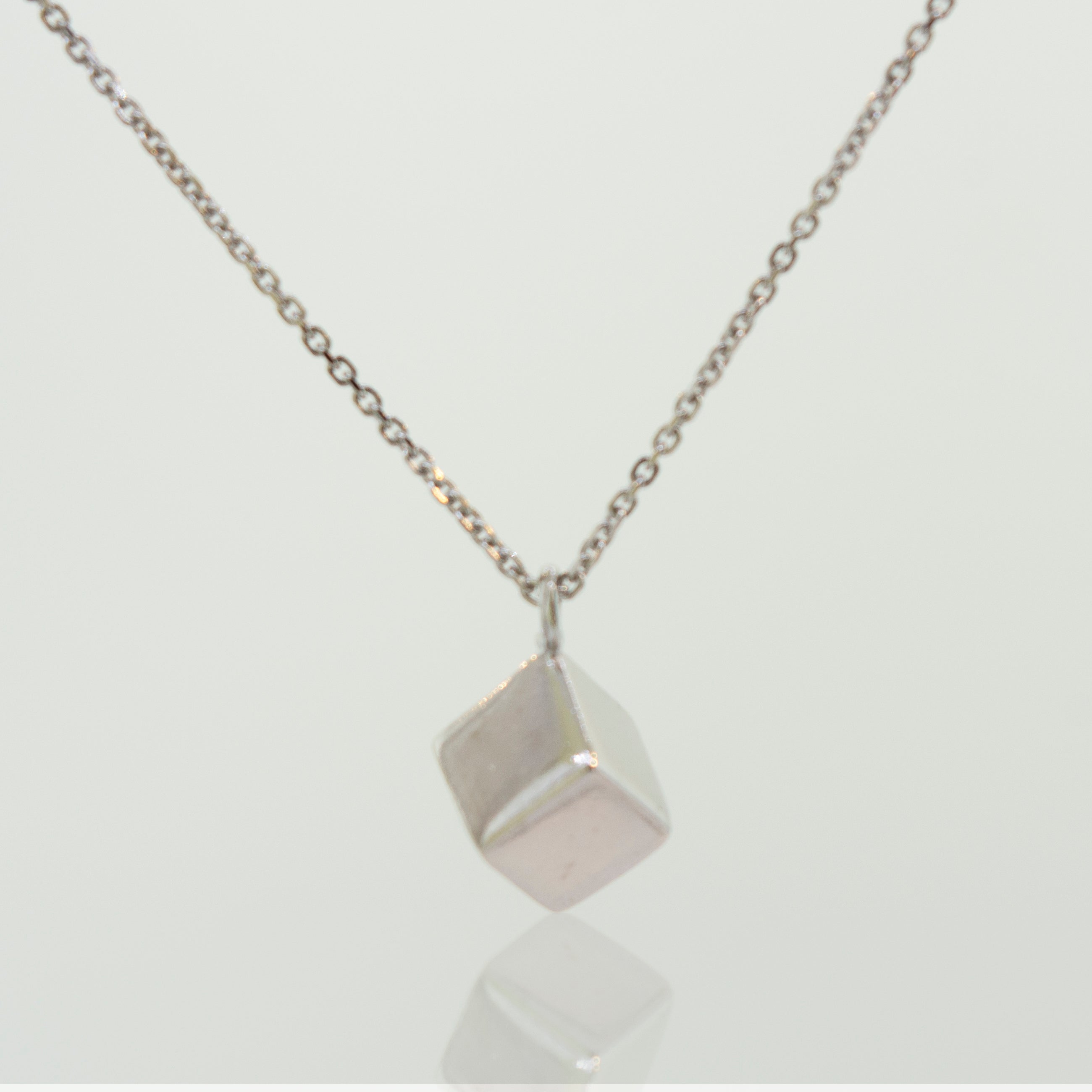 A Sleek Three Dimensional Silver Cube Necklace by Super Silver.