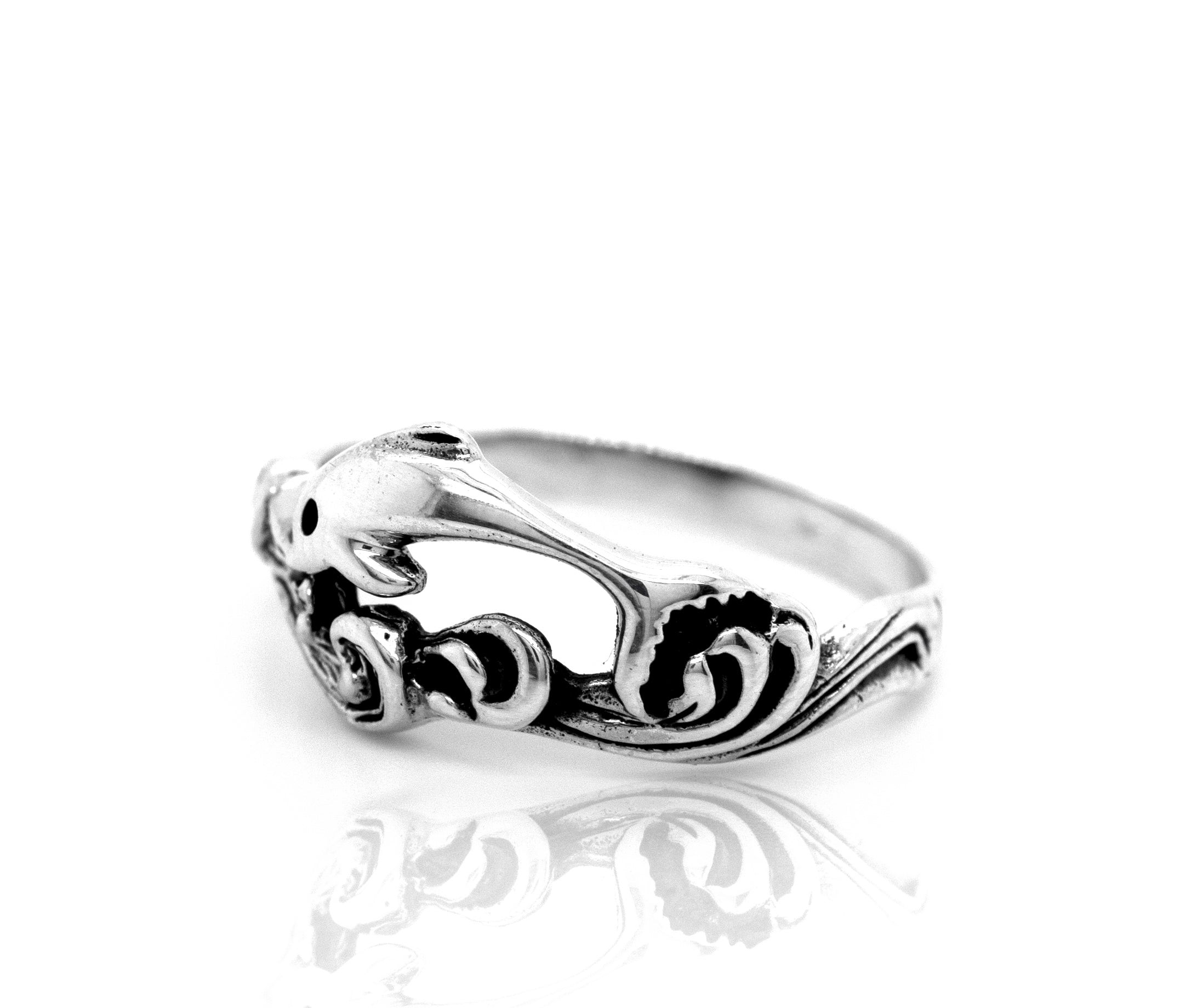 A sterling silver Swimming Dolphin Ring.