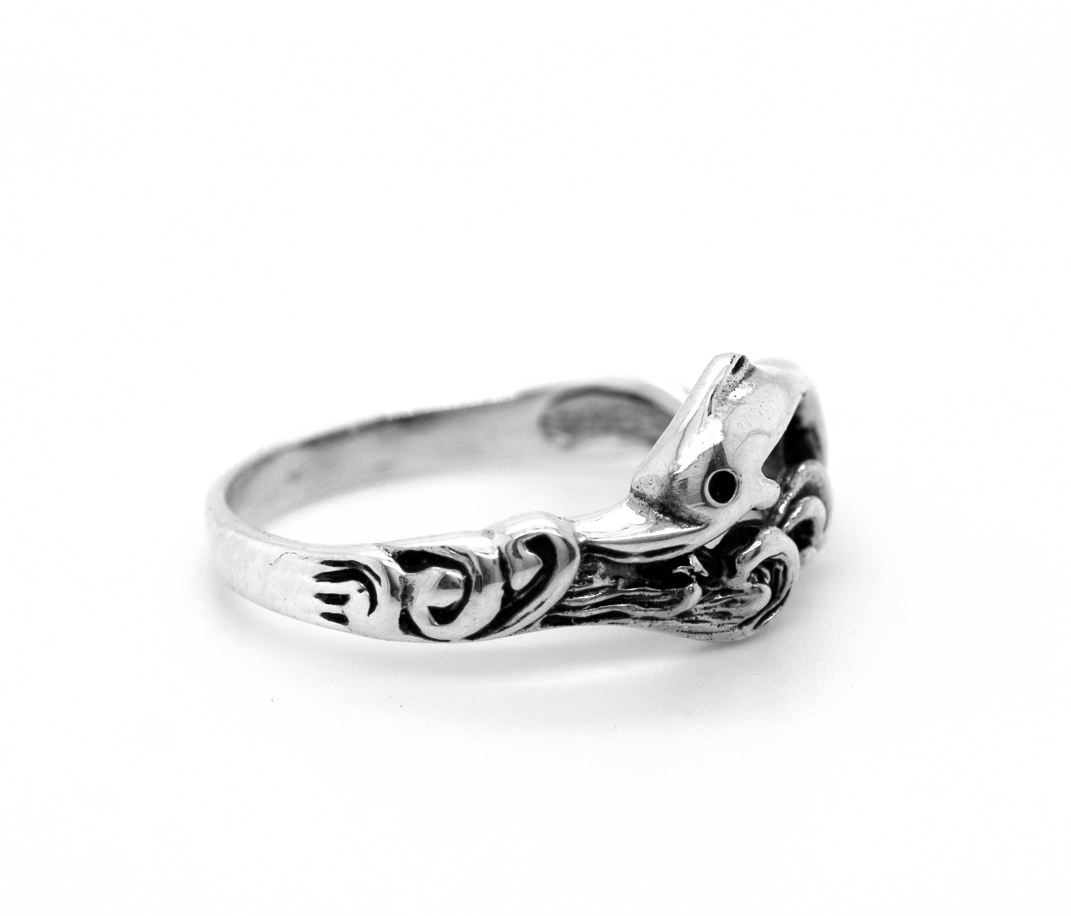 A sterling silver Swimming Dolphin Ring with a bird on it.