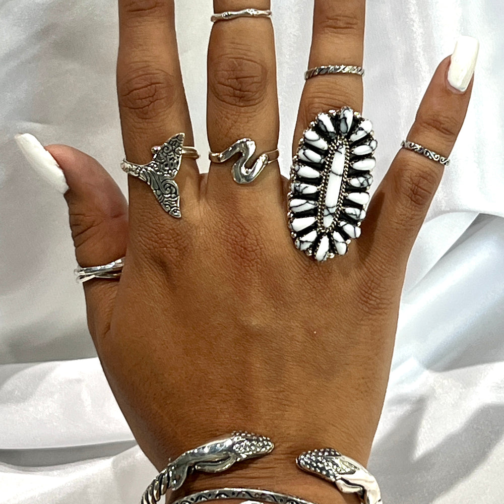 
                  
                    A woman's hand adorned with Super Silver's Exquisite Whale Hinge Bracelet, reminiscent of the tranquil ocean vibes of Santa Cruz.
                  
                