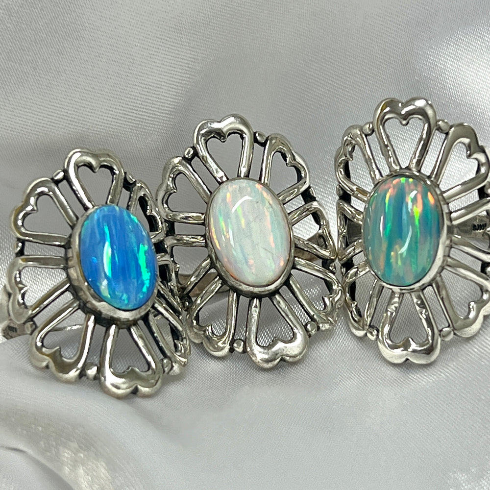 Three American Made Opal Flower Rings with Heart Shaped Petals, handcrafted by Super Silver.