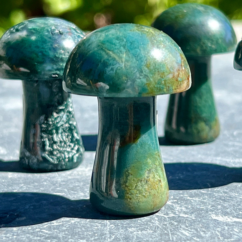 
                  
                    A group of Moss Agate Mushrooms adorning a cottagecore-inspired table decor.
                  
                