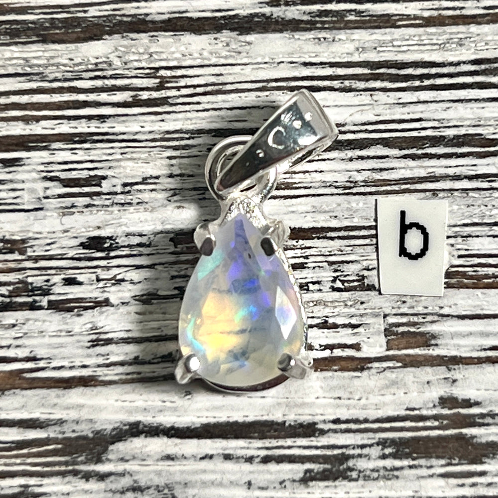 
                  
                    A Super Silver Dainty Prong Set Facet Cut Teardrop Shaped Ethiopian Opal Pendant with the letter b.
                  
                
