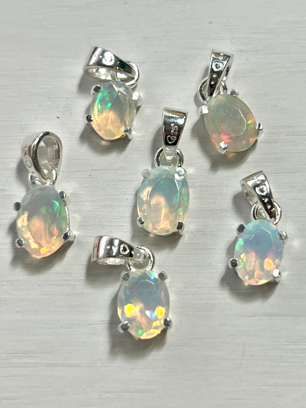 Tiny Facet Cut Prong Set Ethiopian Opal Pendant
