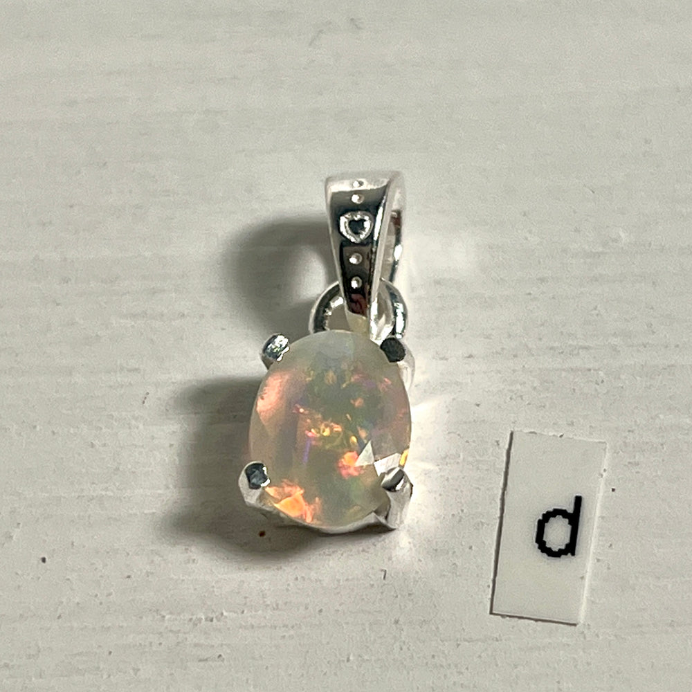 
                  
                    A Tiny Facet Cut Prong Set Ethiopian Opal Pendant from Super Silver set in .925 sterling silver.
                  
                