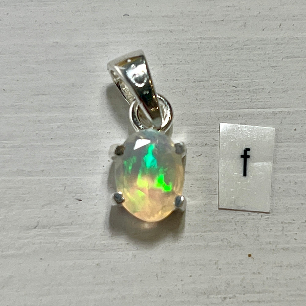 
                  
                    A Super Silver Tiny Facet Cut Prong Set Ethiopian Opal Pendant featuring a delicate Ethiopian opal in vibrant green.
                  
                