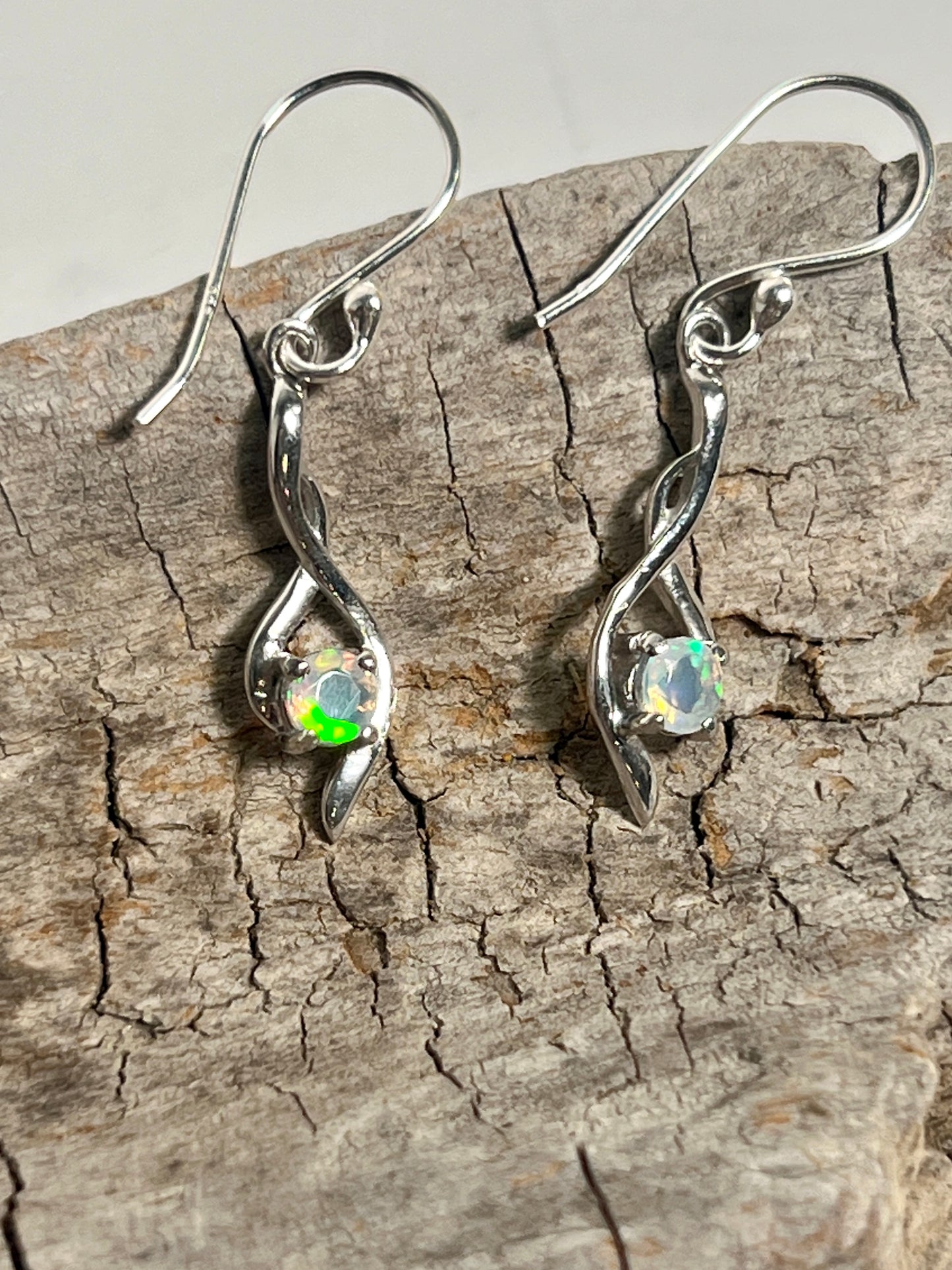 A pair of Super Silver Modern Ethiopian Opal Earrings, exuding glamour.