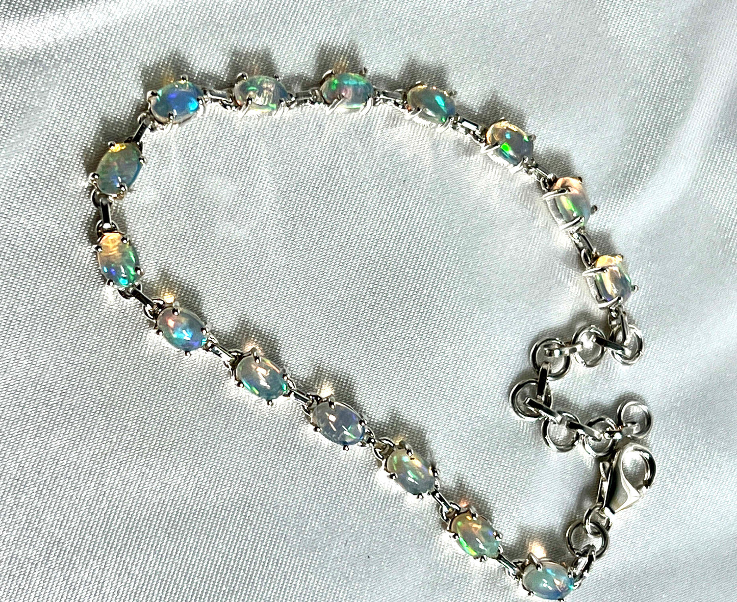 
                  
                    A glamorous Delicate Ethiopian Opal bracelet adorned with opal crystals by Super Silver.
                  
                