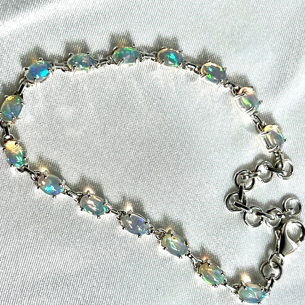 
                  
                    A Delicate Ethiopian Opal Bracelet adorned with Super Silver crystals, exuding glamour.
                  
                