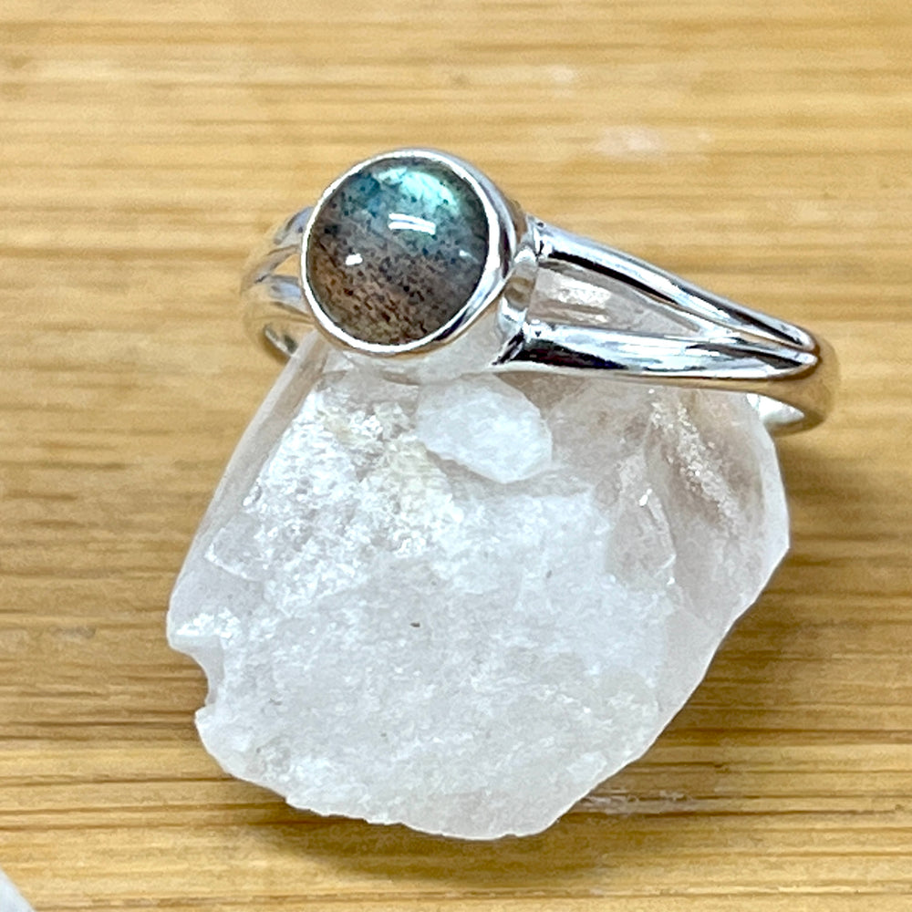 
                  
                    Circular Minimalist Stone Ring - a beautiful piece of jewelry crafted with sterling silver, showcasing the mesmerizing labradorite stone, by Super Silver.
                  
                
