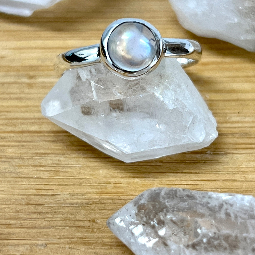 
                  
                    A Simple Moonstone and Labradorite Stacking Ring by Super Silver with a moonstone on top of crystal stones.
                  
                