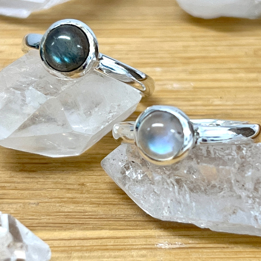 
                  
                    Two Simple Moonstone and Labradorite Stacking Rings featuring labradorite on top, from Super Silver.
                  
                