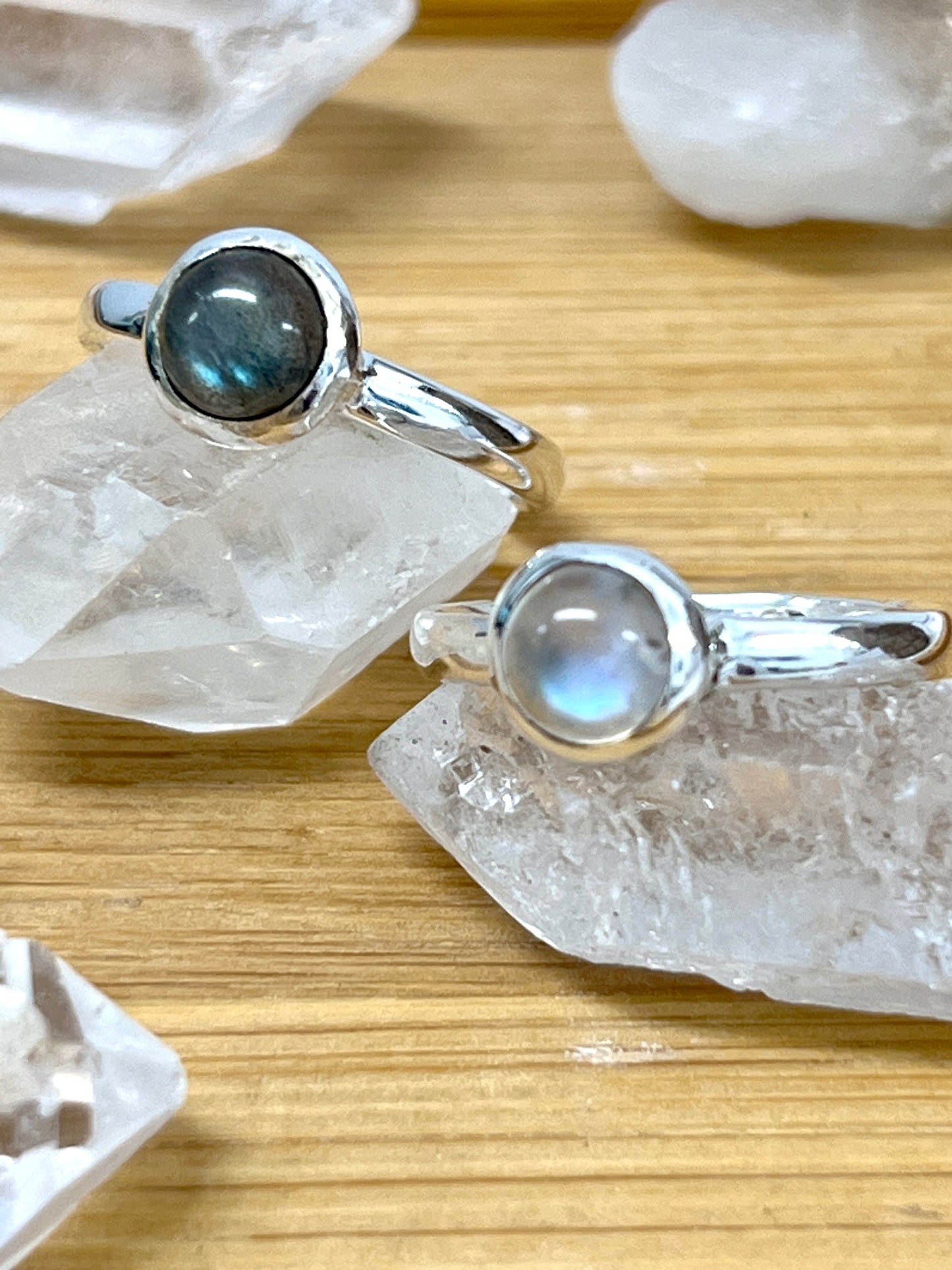 
                  
                    Two Simple Moonstone and Labradorite Stacking Rings featuring labradorite on top, from Super Silver.
                  
                