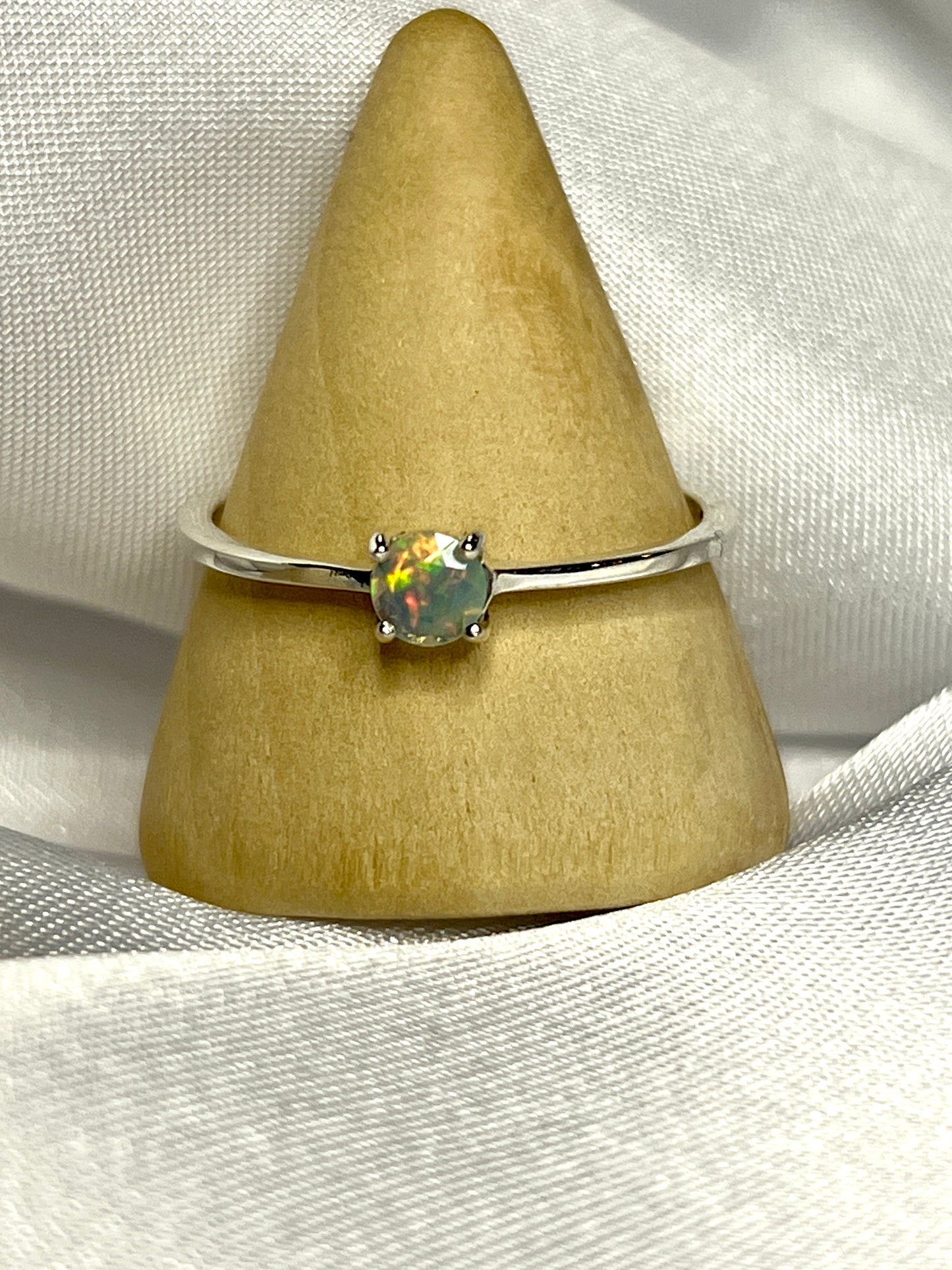 
                  
                    An elegant Dainty Prong Set Facet Cut Ethiopian Opal Ring, making a subtle statement.
                  
                