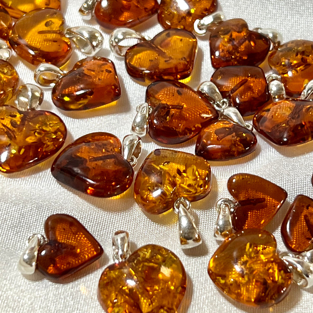 Super Silver's Charming Baltic Amber Heart Pendant charms.
