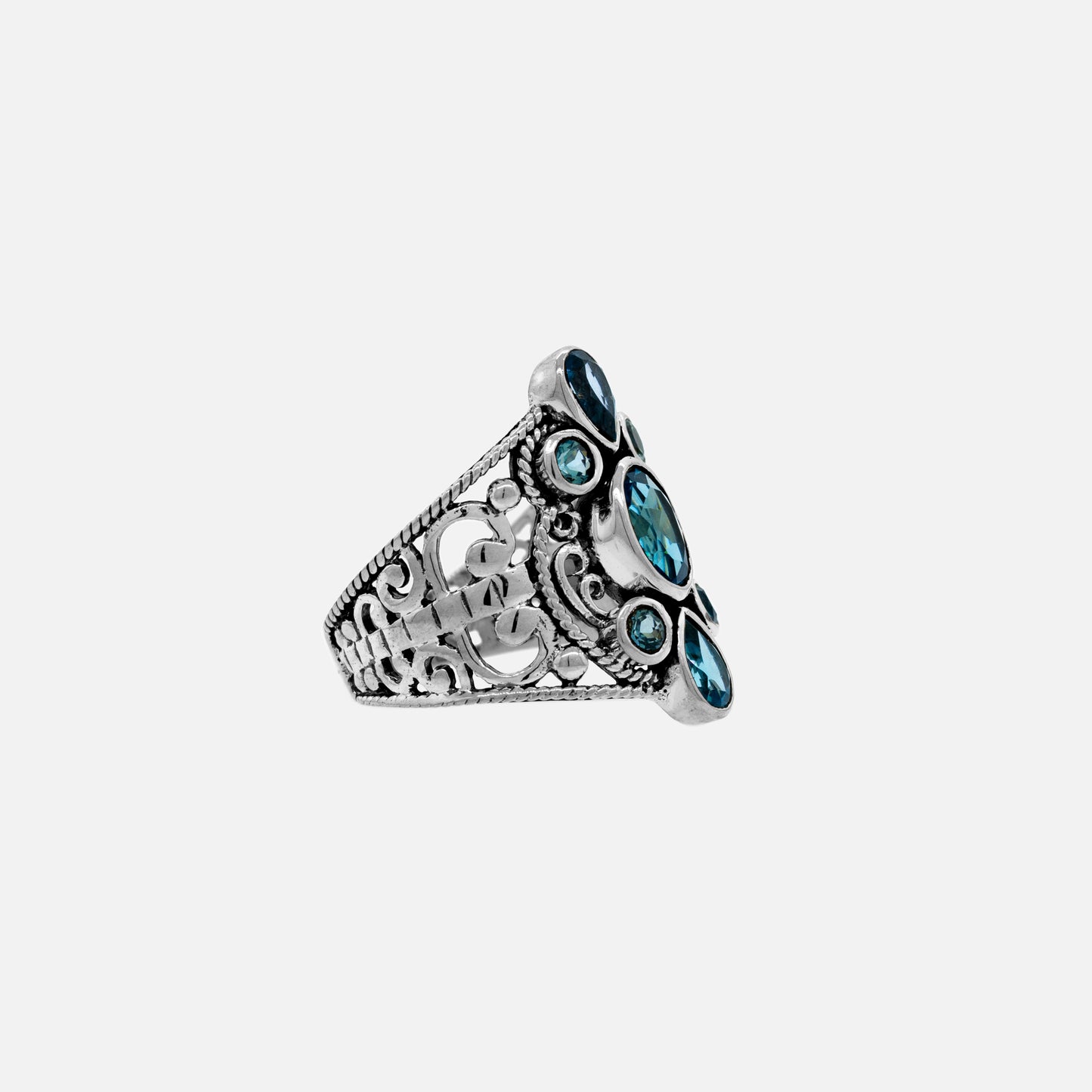 A passerby noticed a Super Silver ring adorned with sparkling blue topaz stones from the Various Beautiful Stone Rings with Filigree Cutout collection.