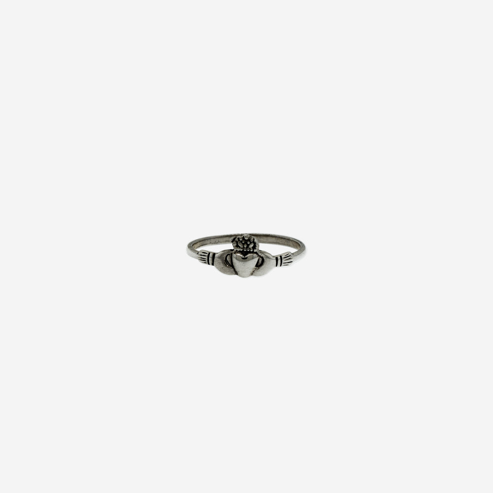 A cultural Claddagh Thin Band Ring on a white background.