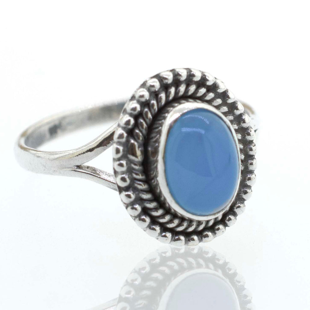 
                  
                    A boho Gemstone Oval Shield Ring with a blue stone.
                  
                