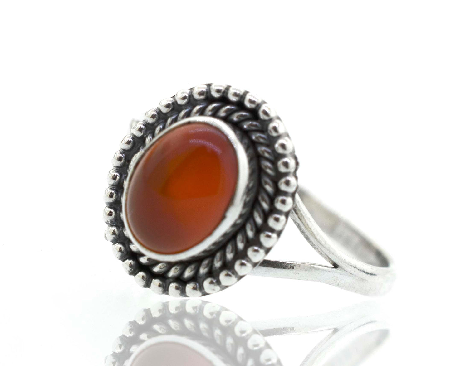 
                  
                    A boho silver Gemstone Oval Shield Ring with a cabochon orange stone.
                  
                