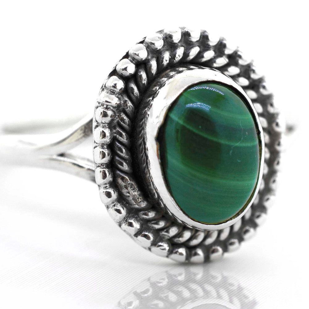 
                  
                    A Super Silver Gemstone Oval Shield Ring with a green malachite gemstone.
                  
                