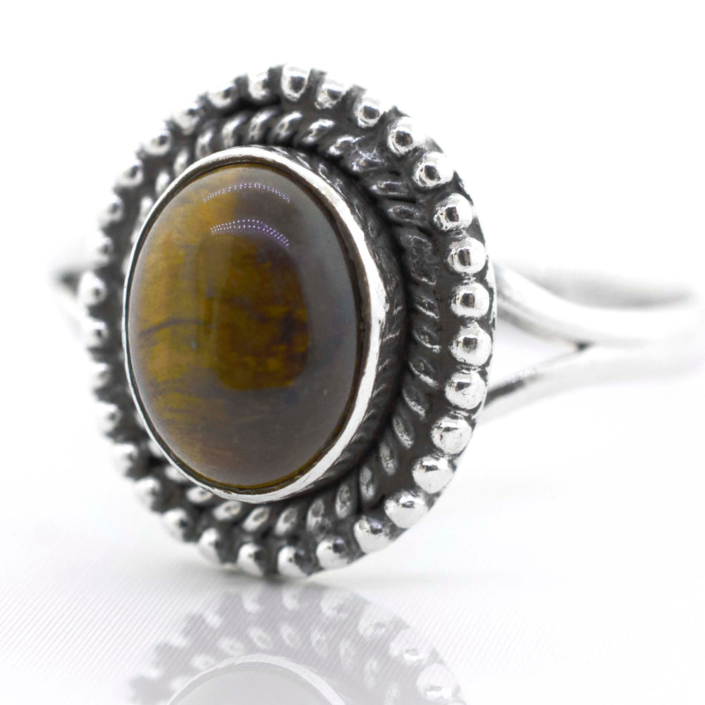 
                  
                    A Super Silver Gemstone Oval Shield Ring with an oval tiger eye stone.
                  
                