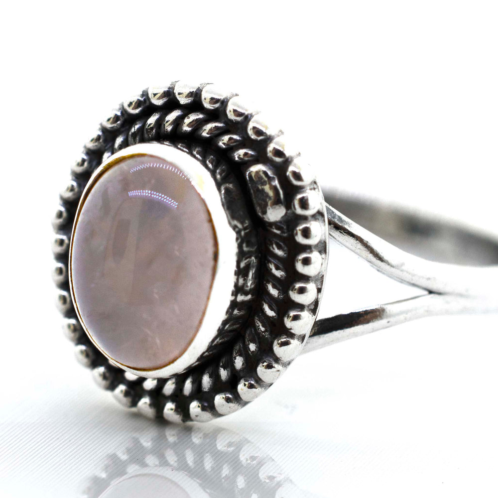 
                  
                    A Super Silver Gemstone Oval Shield Ring with an oval-shaped pink gemstone in the center.
                  
                