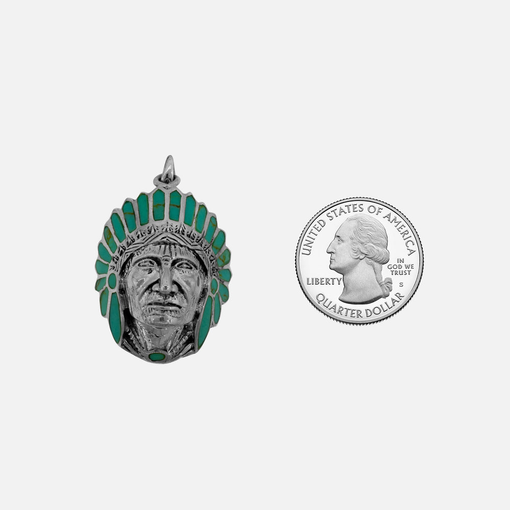 
                  
                    A Super Silver Chief Pendant With Turquoise Stones alongside a statement quarter.
                  
                