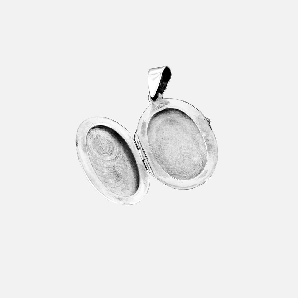 
                  
                    Oval Silver Locket with Flower Design
                  
                