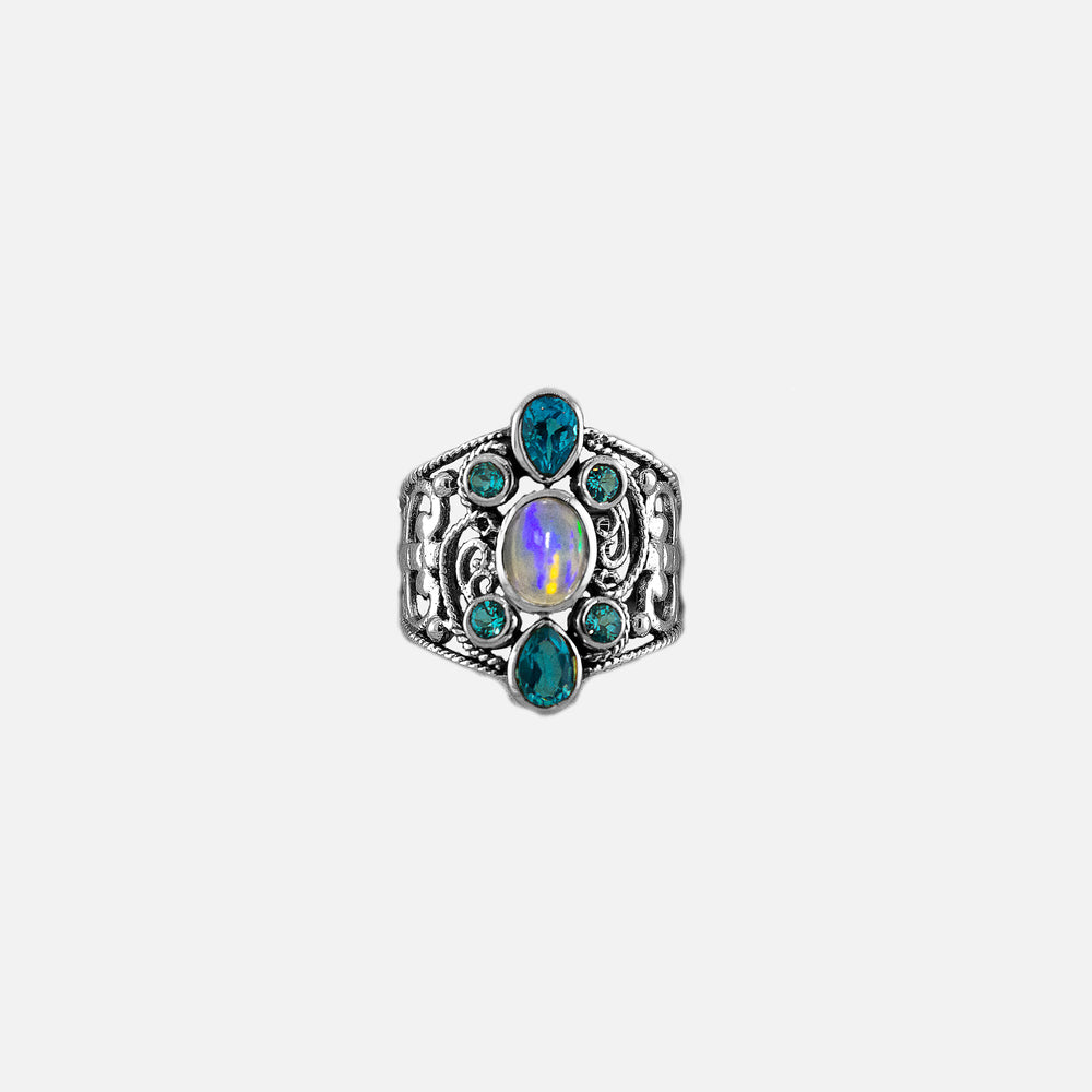 An elegant silver ring with blue topaz stones and an Ethiopian opal, making a statement with its striking blue and green hues.